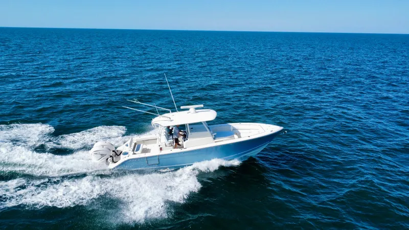  Yacht Photos Pics 2020 Cobia 350 Center Console boat cruising on open ocean waters.