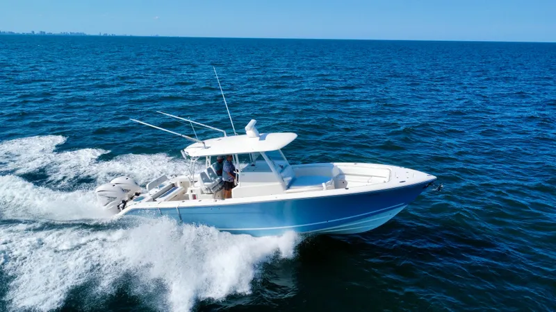  Yacht Photos Pics 2020 Cobia 350 Center Console boat cruising on open ocean waters.