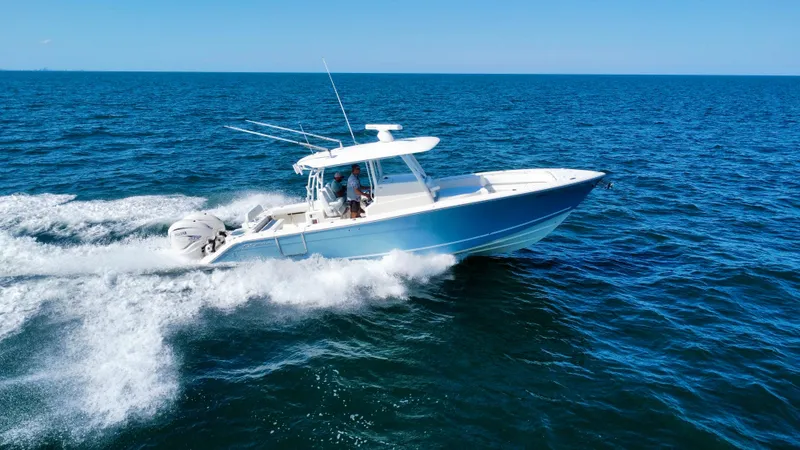  Yacht Photos Pics 2020 Cobia 350 Center Console boat cruising on open ocean waters.