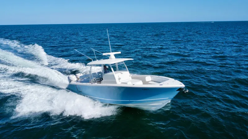  Yacht Photos Pics 2020 Cobia 350 Center Console boat cruising on open ocean waters.