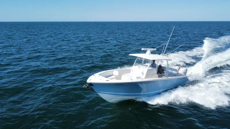  Yacht Photos Pics 2020 Cobia 350 Center Console boat cruising on open ocean waters.