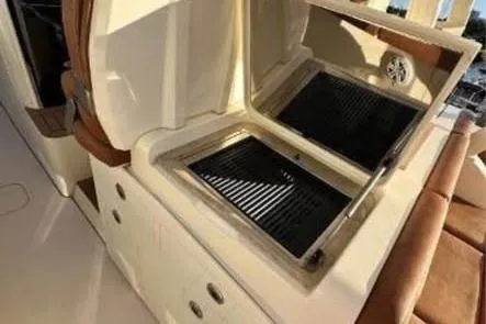  Yacht Photos Pics 2019 Scout 420 LXF boat grill station with dual grills and storage.