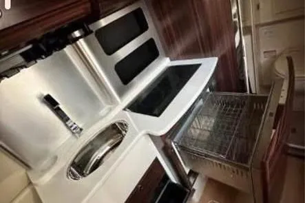  Yacht Photos Pics 2019 Scout 420 LXF yacht kitchen with modern appliances and sleek design.