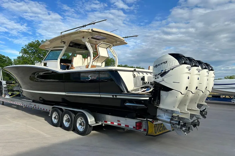  Yacht Photos Pics 2019 Scout 420 LXF boat on trailer with four powerful outboard engines.
