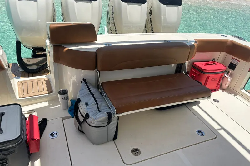  Yacht Photos Pics 2019 Scout 420 LXF boat interior with seating and coolers on deck.