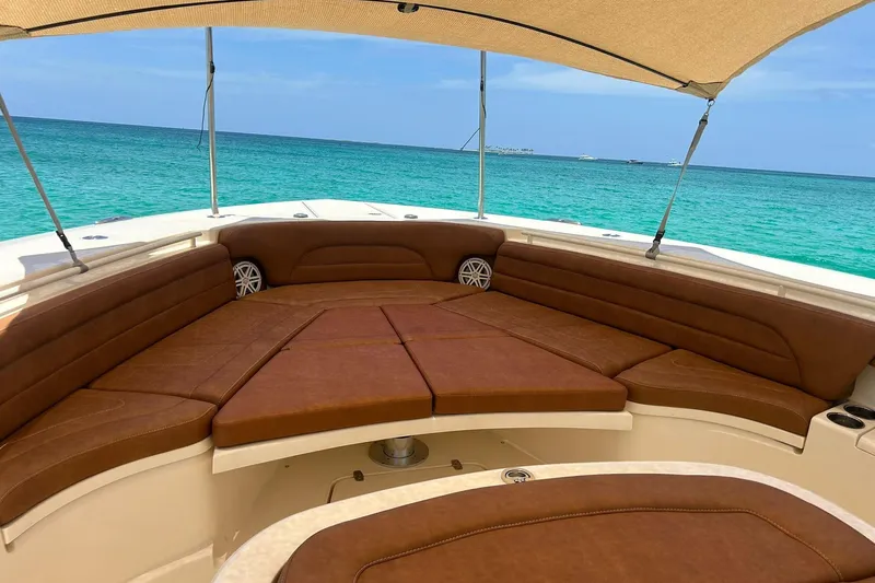  Yacht Photos Pics Luxurious 2019 Scout 420 LXF boat interior with brown seating, ocean view.