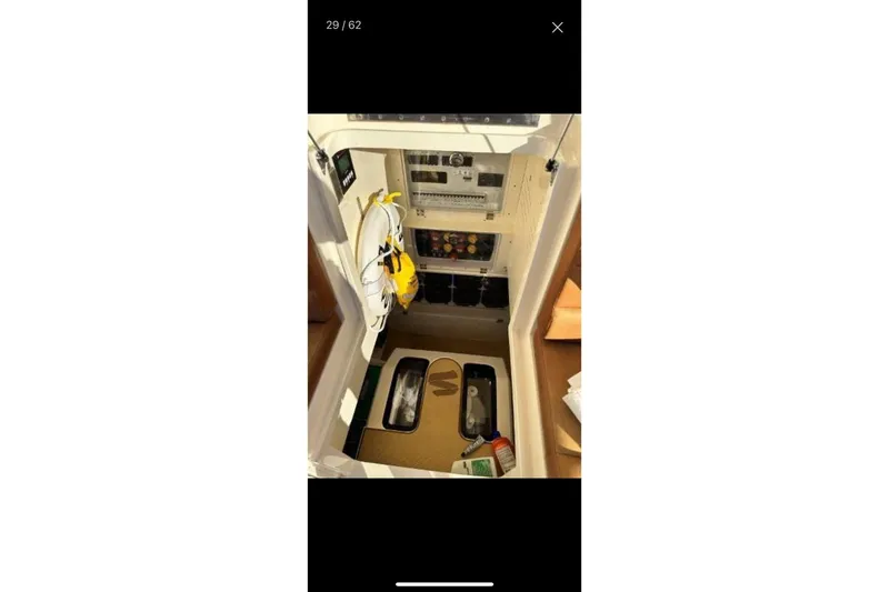  Yacht Photos Pics Interior view of 2019 Scout 420 LXF boat showing storage and equipment area.