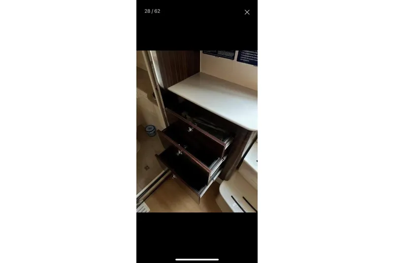  Yacht Photos Pics Interior of 2019 Scout 420 LXF boat with open storage drawers.