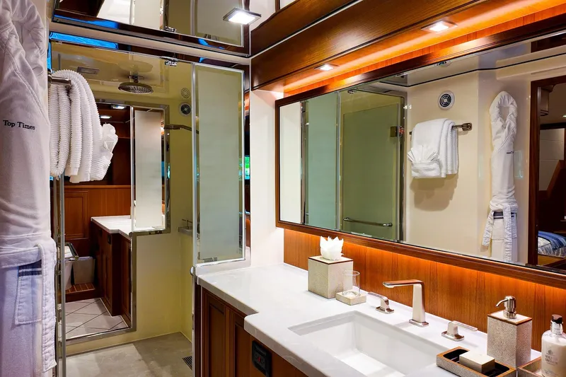 Top Times Yacht Photos Pics Luxurious bathroom in 2022 Marlow Voyager Series yacht, featuring elegant fixtures and modern design.