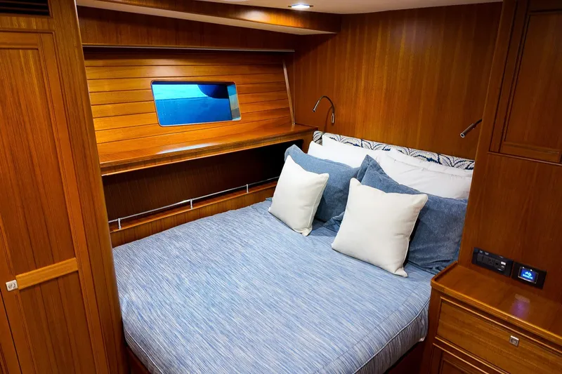 Top Times Yacht Photos Pics Luxurious cabin interior of 2022 Marlow Voyager Series yacht with cozy bedding.