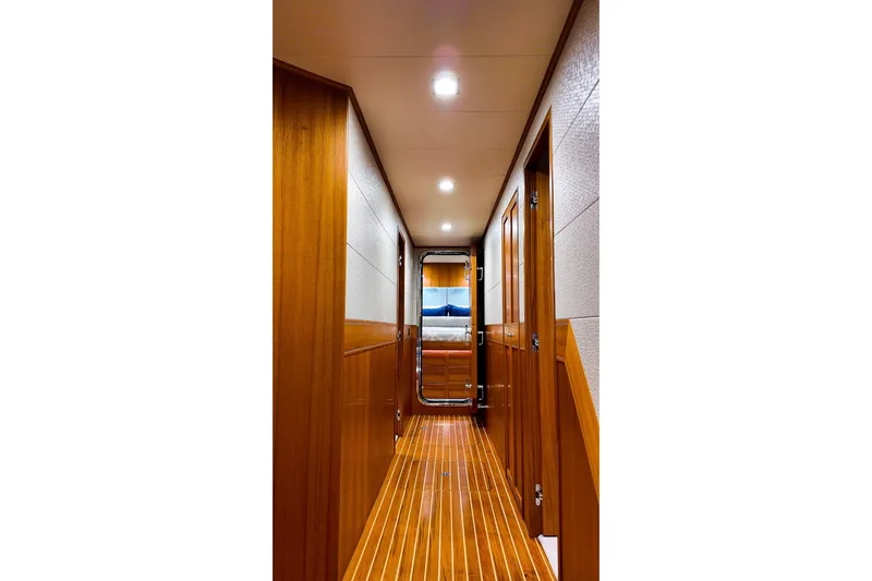 Top Times Yacht Photos Pics Luxurious wooden hallway inside 2022 Marlow Voyager Series yacht.