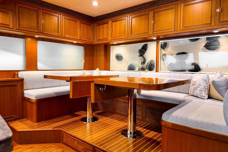 Top Times Yacht Photos Pics Luxurious interior of 2022 Marlow Voyager Series yacht with elegant wood finish and plush seating.