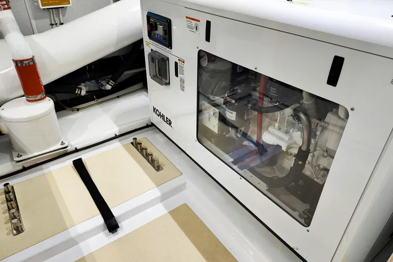 Top Times Yacht Photos Pics Engine room of 2022 Marlow Voyager Series yacht featuring Kohler generator.