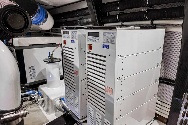 Top Times Yacht Photos Pics Engine room of 2022 Marlow Voyager Series yacht with advanced equipment and systems.