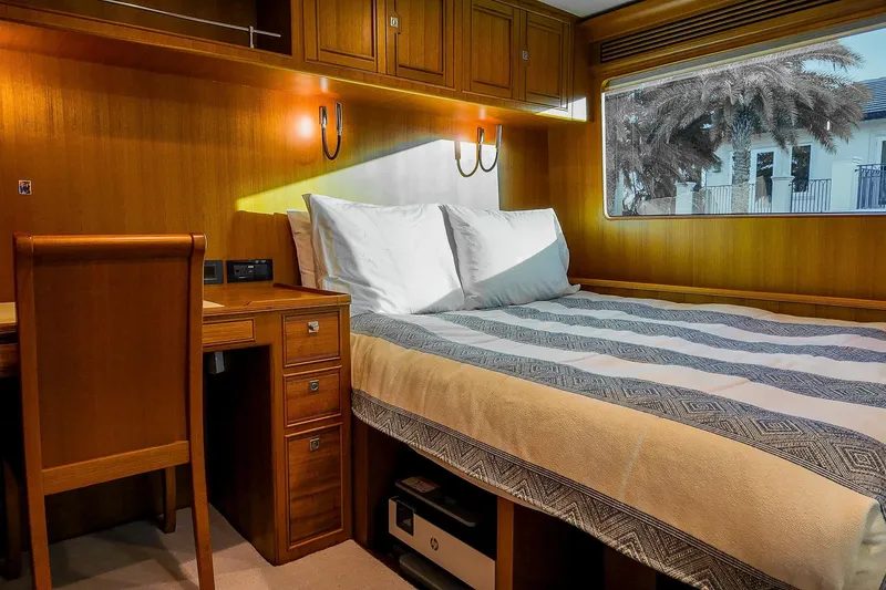 Top Times Yacht Photos Pics Luxurious cabin interior of 2022 Marlow Voyager Series yacht with wooden furnishings.