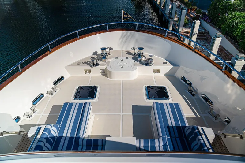 Top Times Yacht Photos Pics Luxurious 2022 Marlow Voyager yacht deck with striped seating and polished fittings.