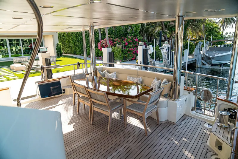 Top Times Yacht Photos Pics Luxurious 2022 Marlow Voyager yacht deck with elegant seating and waterfront view.
