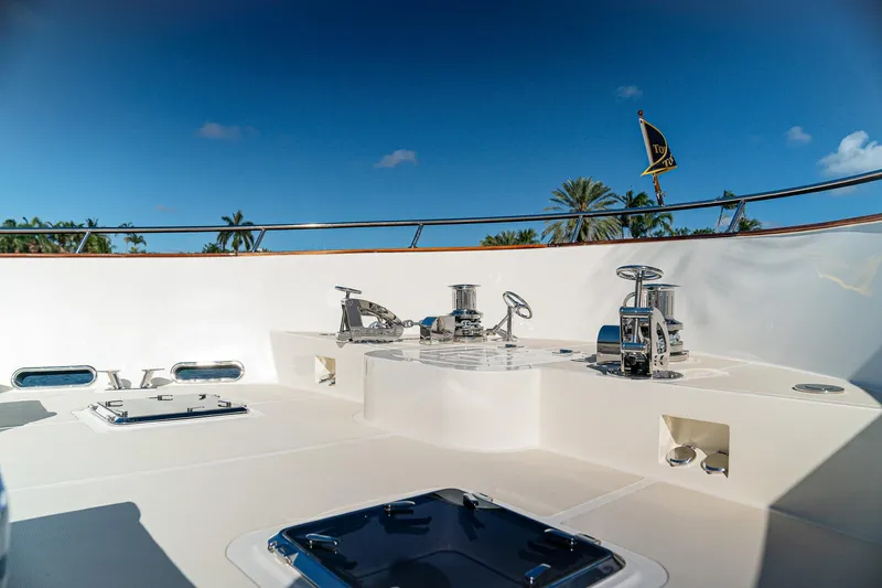 Top Times Yacht Photos Pics 2022 Marlow Voyager yacht deck with winches and hatches under clear blue sky.