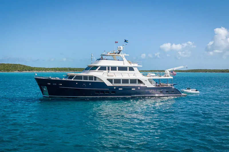 Top Times Yacht Photos Pics Luxury Marlow Voyager Series yacht, 2022 model, cruising in clear blue ocean waters.