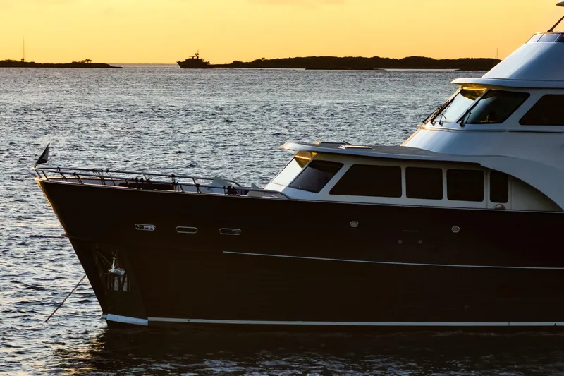 Top Times Yacht Photos Pics 2022 Marlow Voyager yacht at sunset on calm waters.