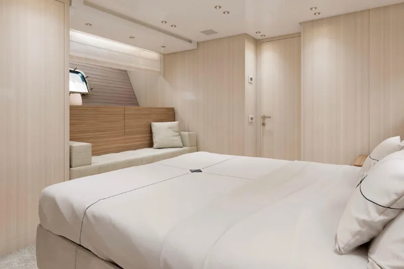  Yacht Photos Pics Luxurious 2025 Sanlorenzo SX88 yacht bedroom with modern design and cozy seating area.