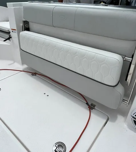  Yacht Photos Pics 2023 Sea Fox 328 Commander boat seat with white upholstery and hexagonal pattern.