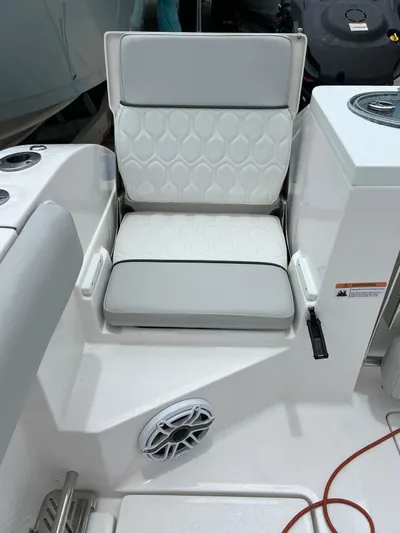  Yacht Photos Pics 2023 Sea Fox 328 Commander boat seat with white upholstery and modern design.