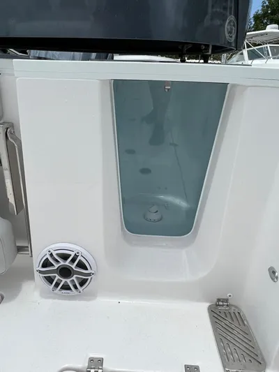  Yacht Photos Pics 2023 Sea Fox 328 Commander boat interior with speaker and storage compartment.