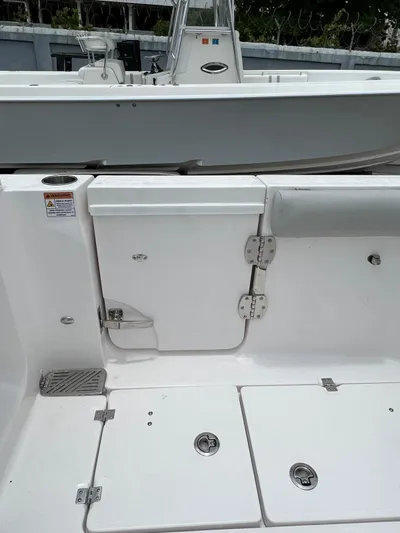  Yacht Photos Pics 2023 Sea Fox 328 Commander boat interior with storage compartments and seating.