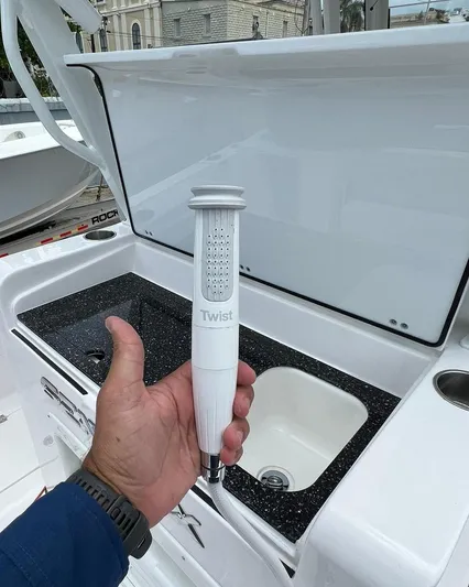  Yacht Photos Pics Hand holding a Twist showerhead on a 2023 Sea Fox 328 Commander boat.