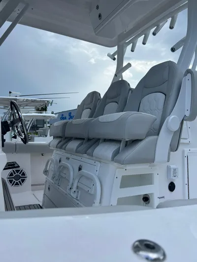  Yacht Photos Pics 2023 Sea Fox 328 Commander boat interior with plush seating and modern design.