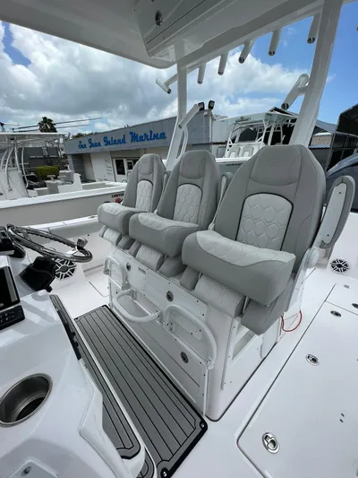  Yacht Photos Pics 2023 Sea Fox 328 Commander boat with luxurious seating and modern design.