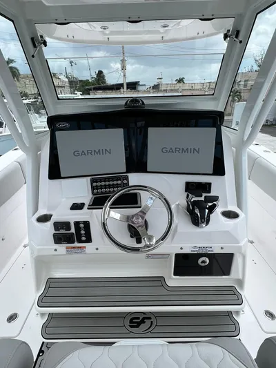  Yacht Photos Pics 2023 Sea Fox 328 Commander boat dashboard with dual Garmin displays.