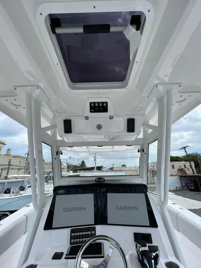  Yacht Photos Pics 2023 Sea Fox 328 Commander helm with Garmin displays and overhead hatch.