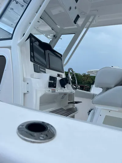  Yacht Photos Pics 2023 Sea Fox 328 Commander boat interior with modern dashboard and seating.