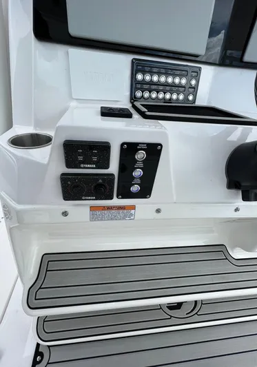  Yacht Photos Pics Control panel of 2023 Sea Fox 328 Commander boat with switches and cup holder.