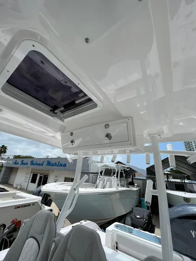  Yacht Photos Pics 2023 Sea Fox 328 Commander boat interior with overhead storage and seating.