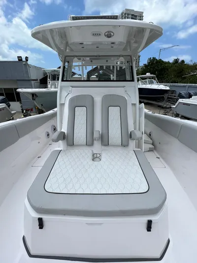  Yacht Photos Pics 2023 Sea Fox 328 Commander boat with sleek seating and modern design.