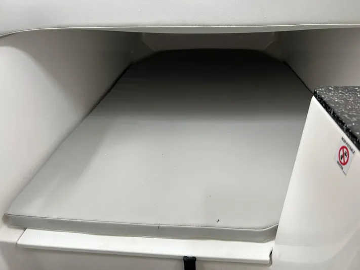  Yacht Photos Pics 2023 Sea Fox 328 Commander cabin interior with cushioned sleeping area.