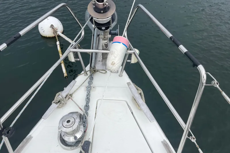  Yacht Photos Pics Bow of 2012 Jeanneau Sun Odyssey 509 sailboat with anchor and mooring buoy.