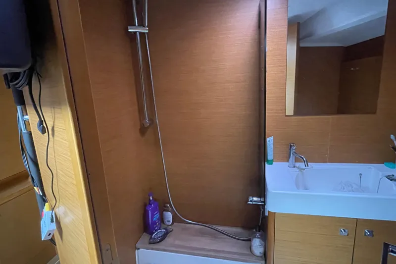  Yacht Photos Pics Bathroom interior of 2012 Jeanneau Sun Odyssey 509 yacht with shower and sink.