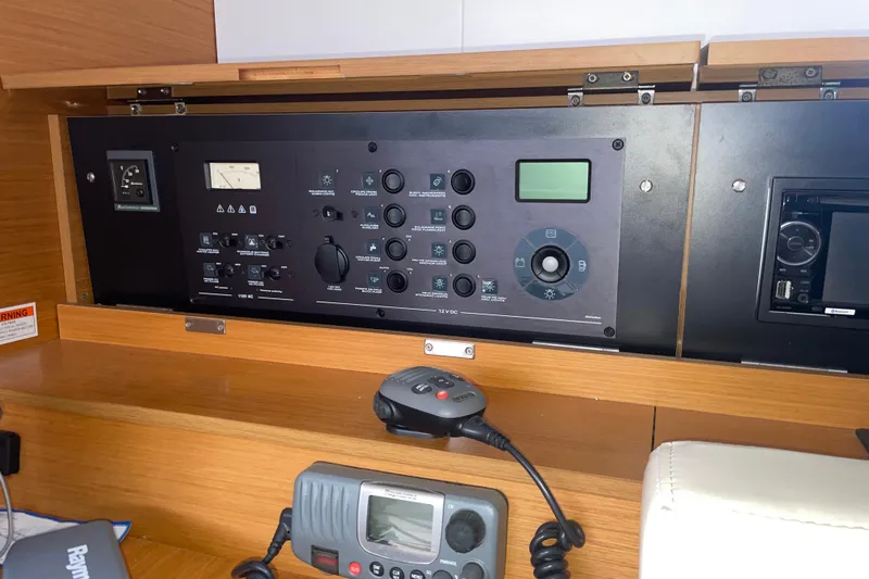  Yacht Photos Pics Control panel of a 2012 Jeanneau Sun Odyssey 509 sailboat, featuring navigation and communication equipment.