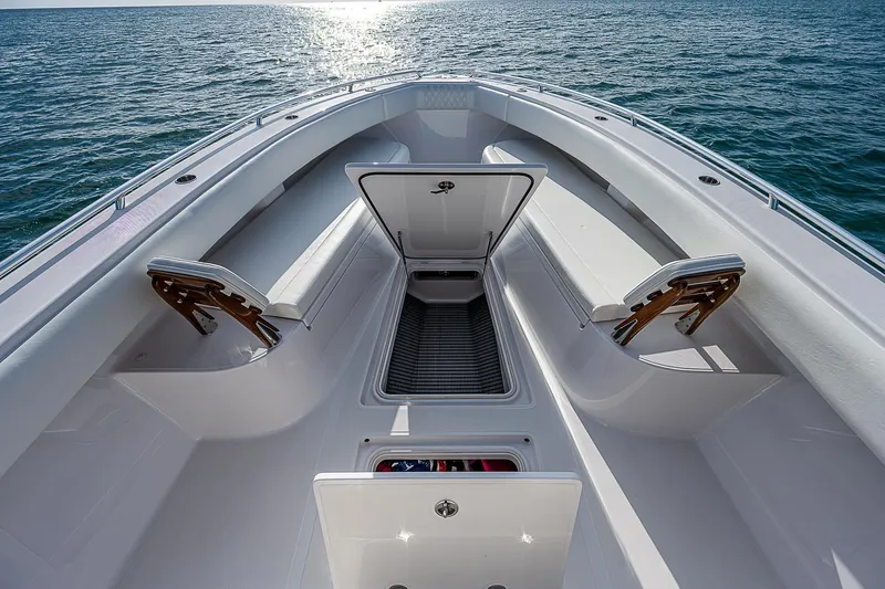 T/t Waterfront Yacht Photos Pics 2013 Bahama Quad V10's boat deck with open storage, surrounded by ocean.