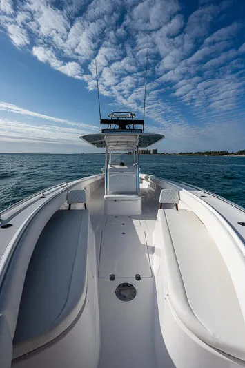T/t Waterfront Yacht Photos Pics 2013 Bahama Quad V10's boat on open water under a partly cloudy sky.