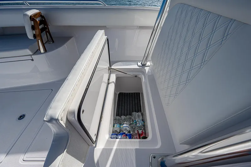 T/t Waterfront Yacht Photos Pics 2013 Bahama Quad V10's boat with open storage compartment containing drinks.