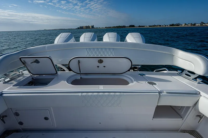 T/t Waterfront Yacht Photos Pics 2013 Bahama Quad V10's boat interior with open compartments, ocean view.