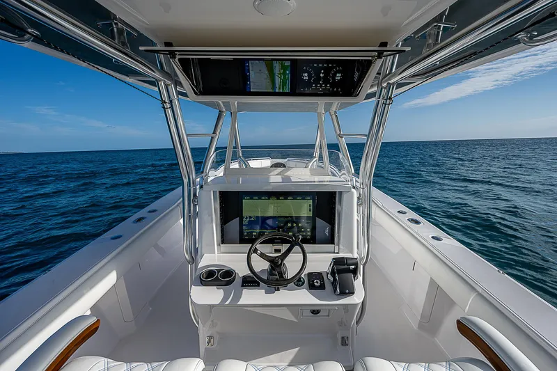 T/t Waterfront Yacht Photos Pics Center console of 2013 Bahama Quad V10's boat on open sea.
