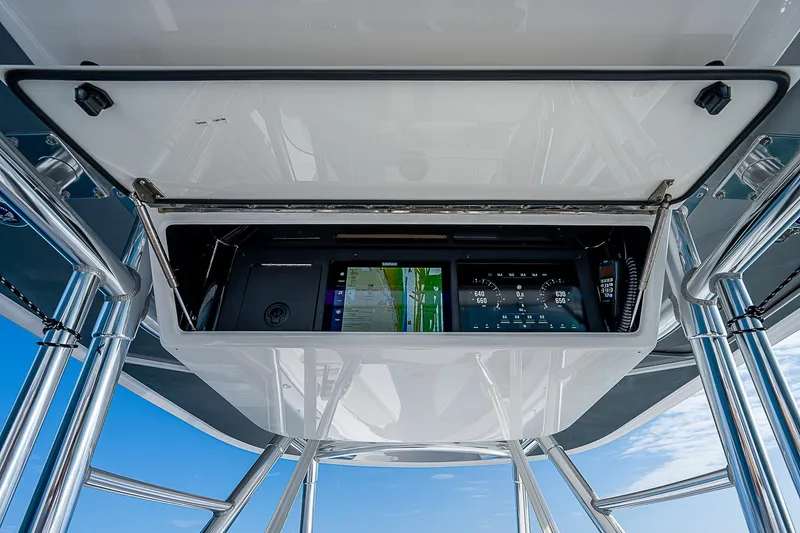 T/t Waterfront Yacht Photos Pics 2013 Bahama Quad V10's boat console with navigation screens and controls.