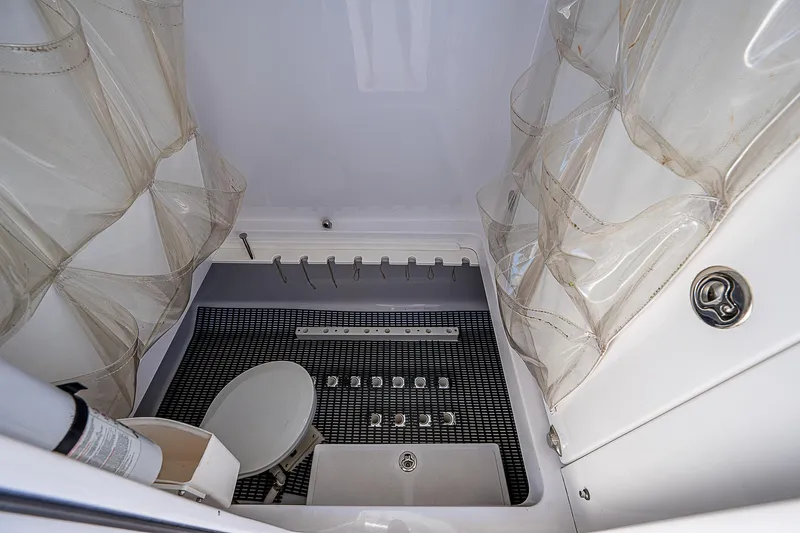 T/t Waterfront Yacht Photos Pics 2013 Bahama Quad V10's interior with storage compartments and netting.