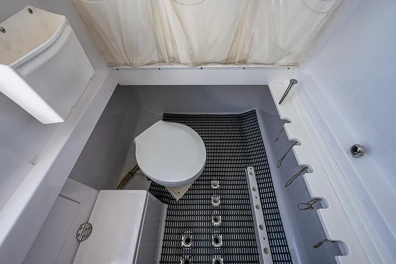 T/t Waterfront Yacht Photos Pics 2013 Bahama Quad V10's boat interior with toilet and shower area.